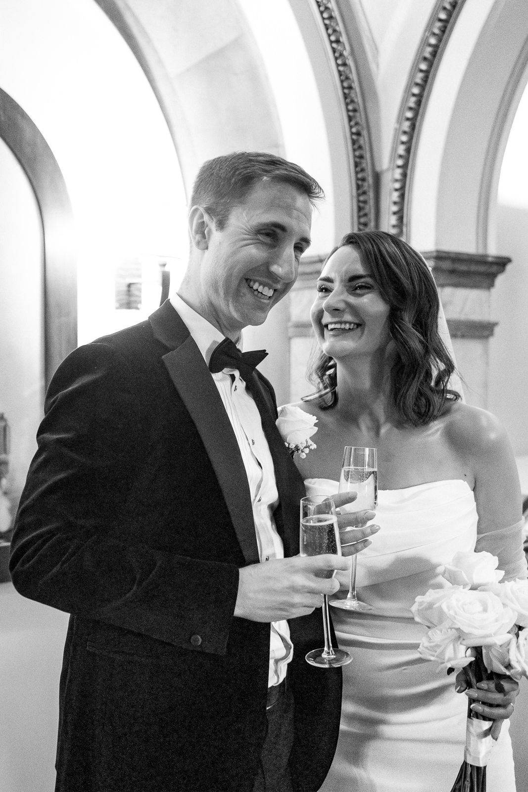 Three candid black and white photos show a joyful wedding reception with the couple sharing intimate moments and laughter.