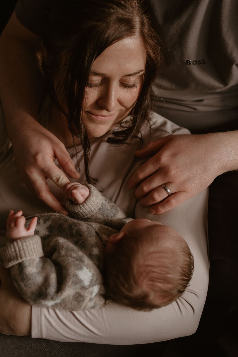 Intimate family moment with newborn baby.