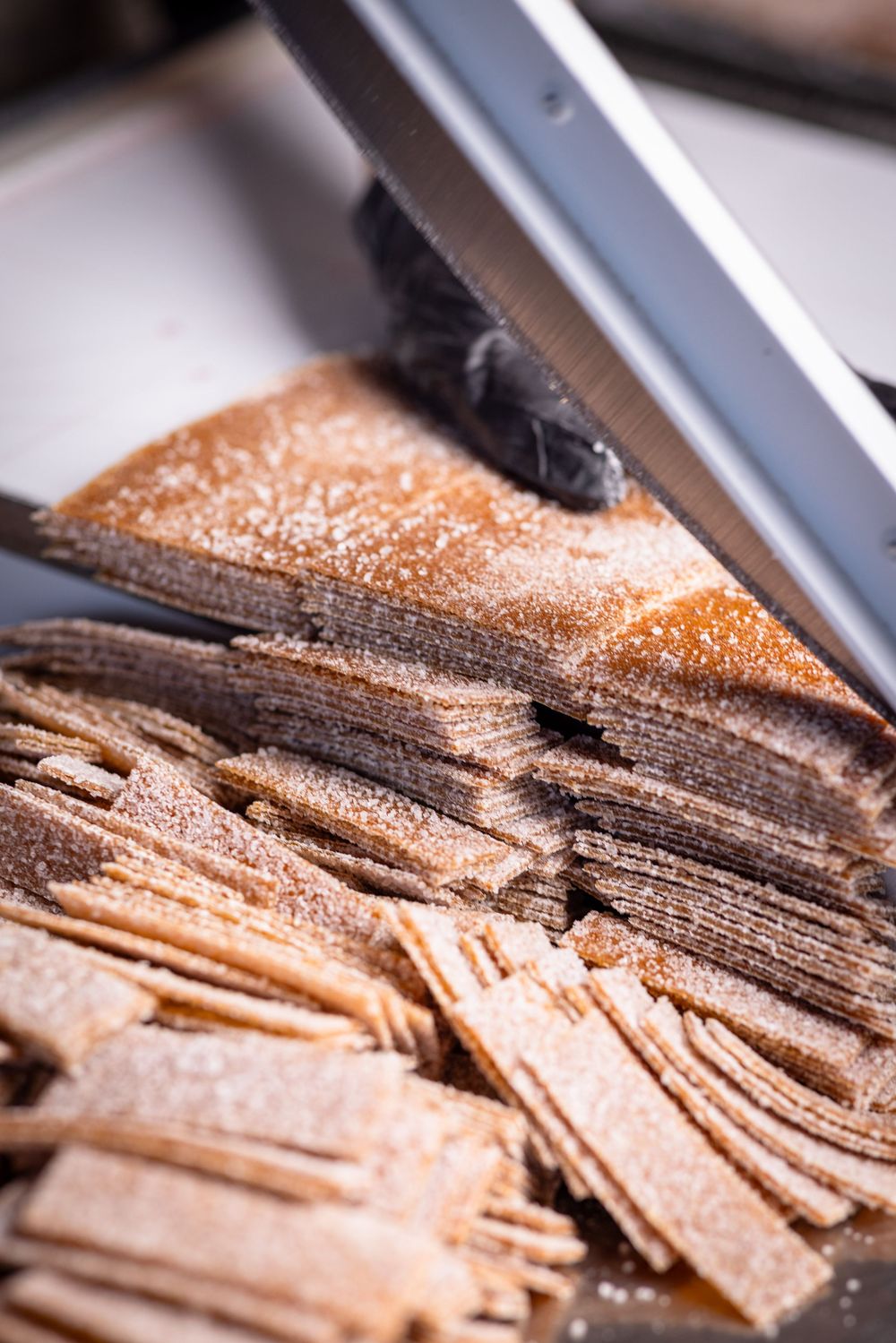 Shaved chocolate curls and flakes dusted with cocoa powder create a decadent dessert topping.