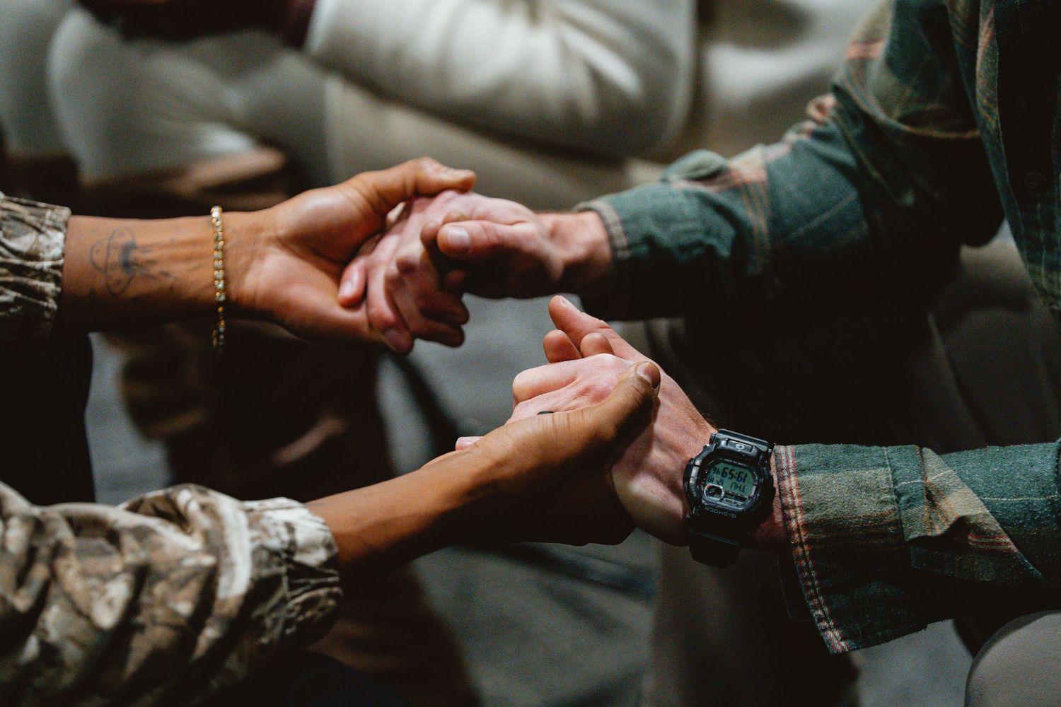 Close-up shot of hands exchanging a ring during a wedding ceremony.