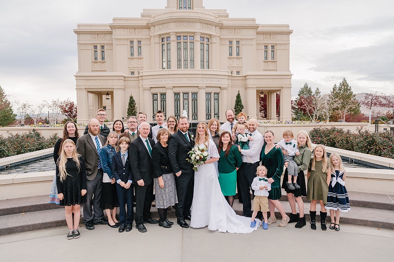 A series of formal group photos taken outside a grand stone building with columns on a cloudy day.