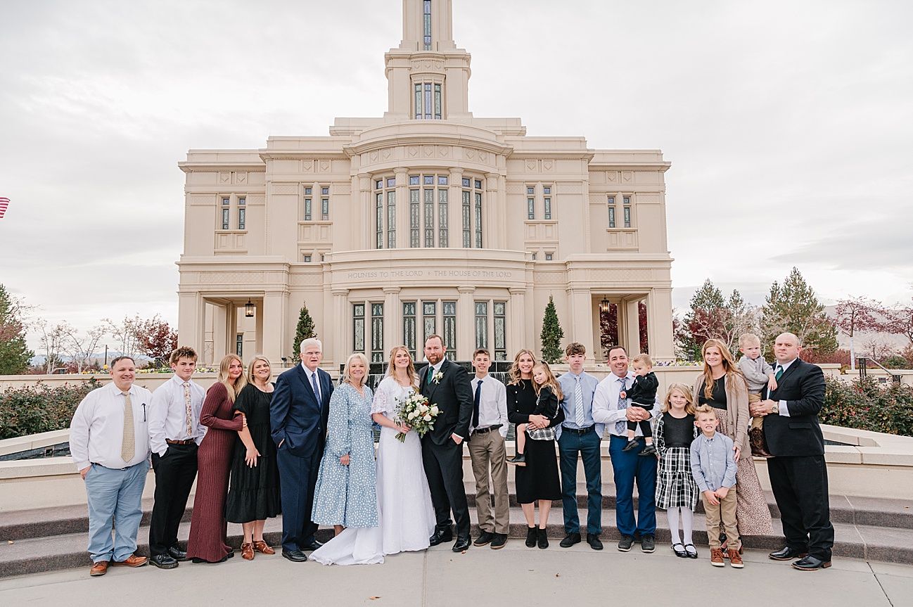 A panoramic sequence of wedding party group photos in front of a white temple building during daytime.