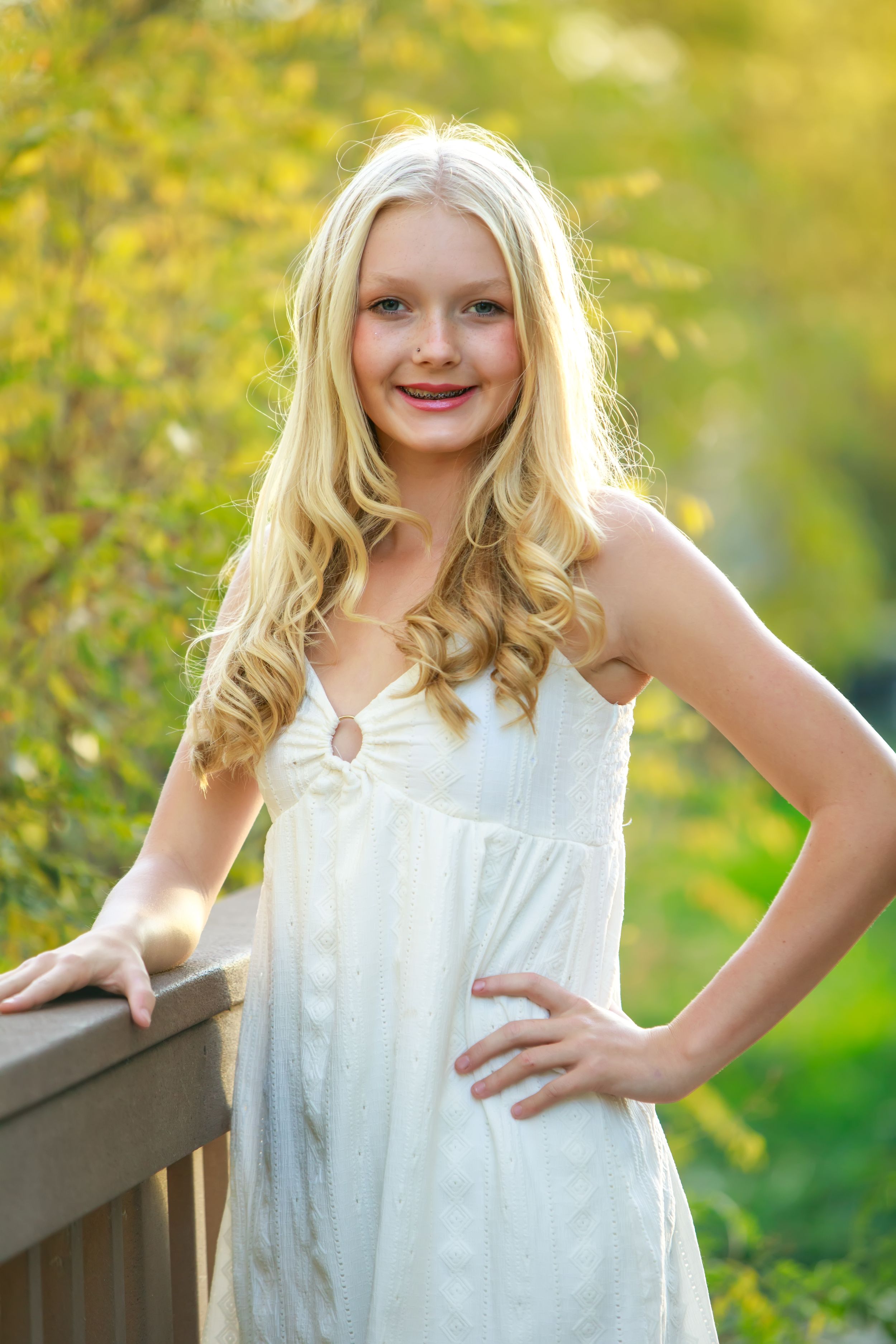 A series of outdoor portrait photos in a white dress against a sunlit natural background with bokeh effect.