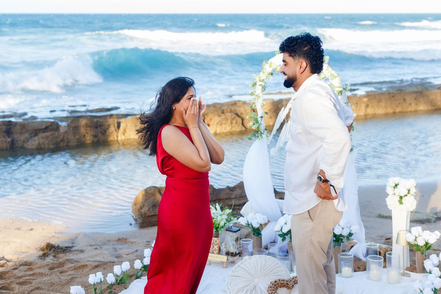 Couples portrait. Proposal and engagement session. Man and woman on the beach. Woman crying. Kikita Surf Beach, Dorado, Puerto Rico.