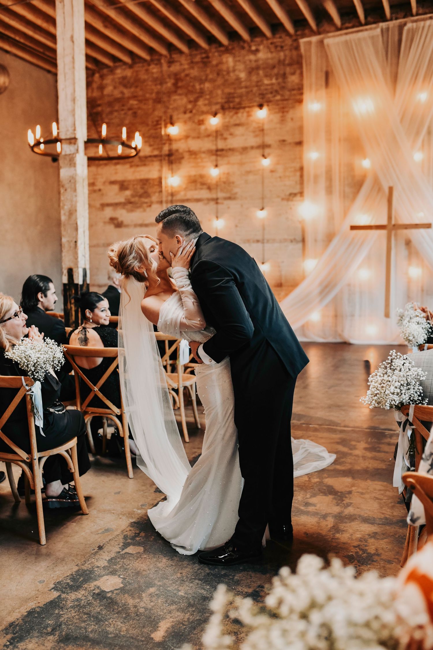 Bride and groom romantic portrait inside industrial wedding venue