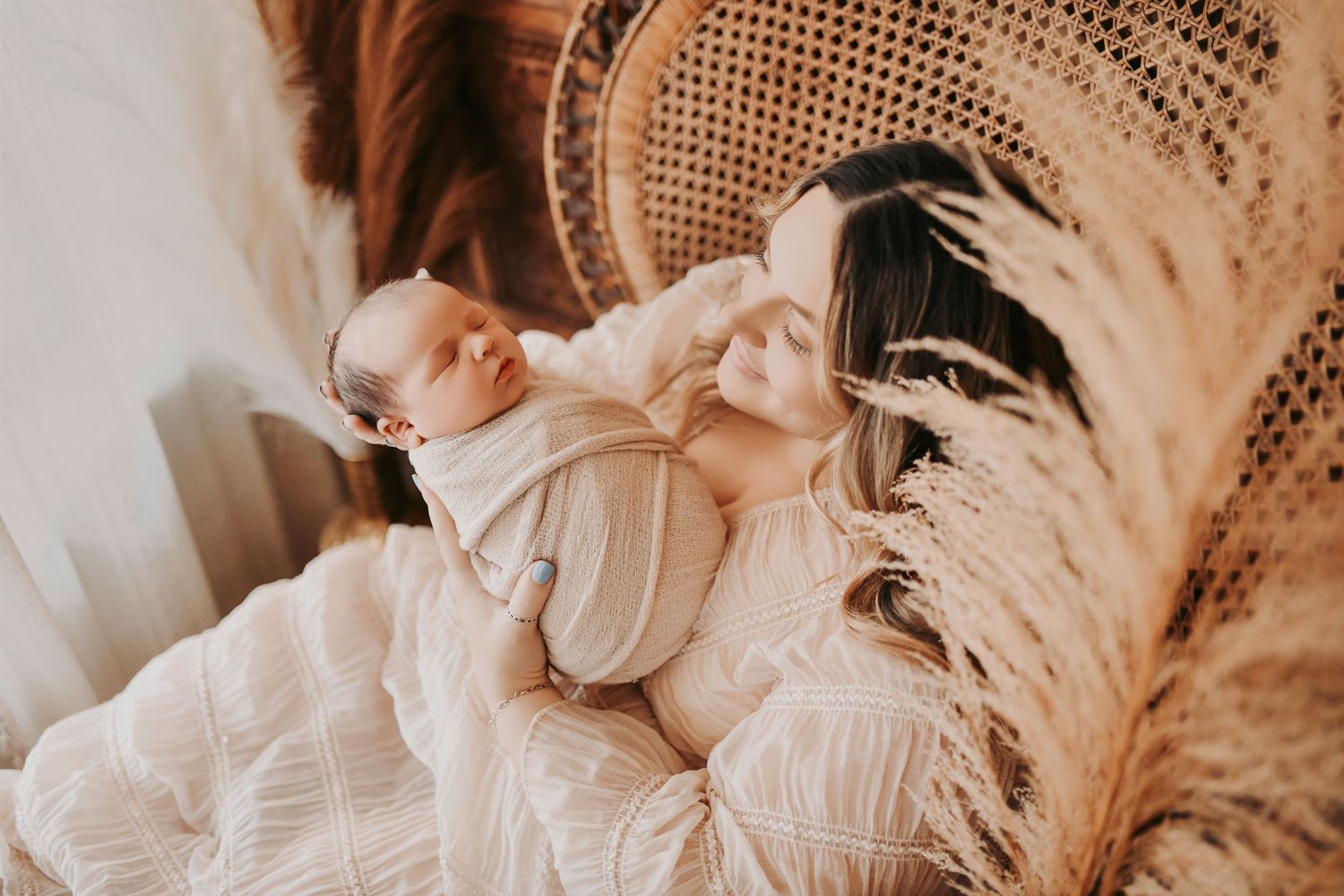 Mother comforting her newborn during a candid lifestyle session
