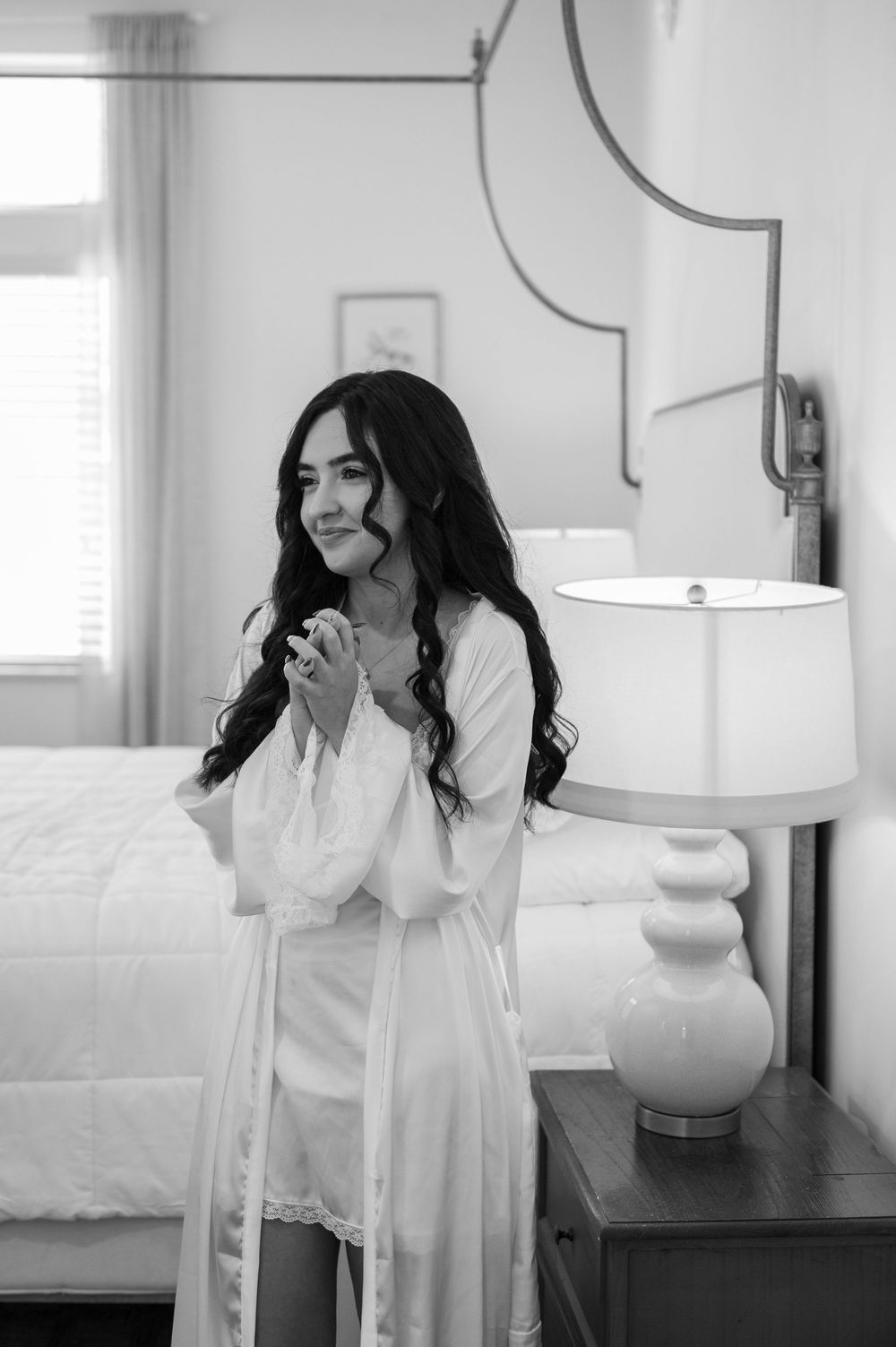 A series of black and white photos showing joyful laughter and candid moments in an indoor setting.