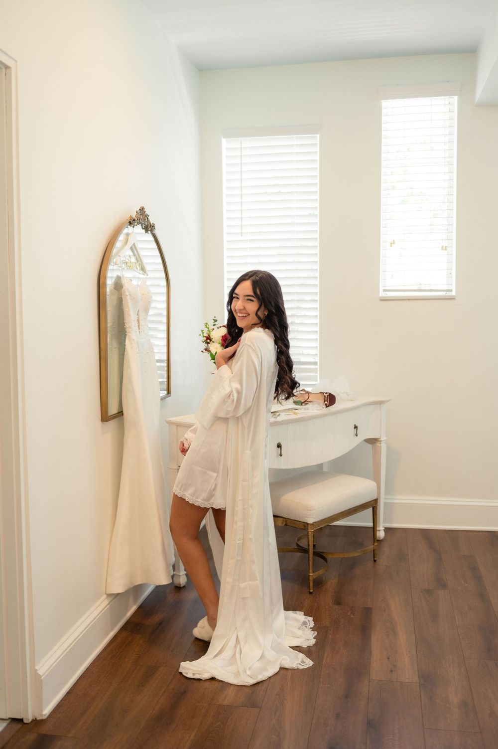 A series of wedding preparation photos showing a bride in a white gown looking at herself in a mirror.
