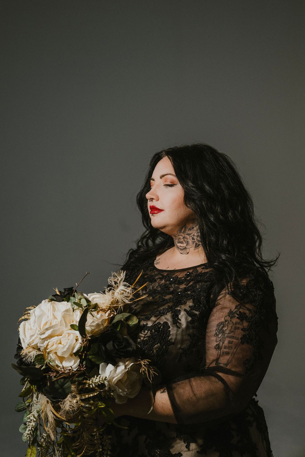 Dramatic portrait series featuring a figure in black lace holding white flowers against a dark gray backdrop.