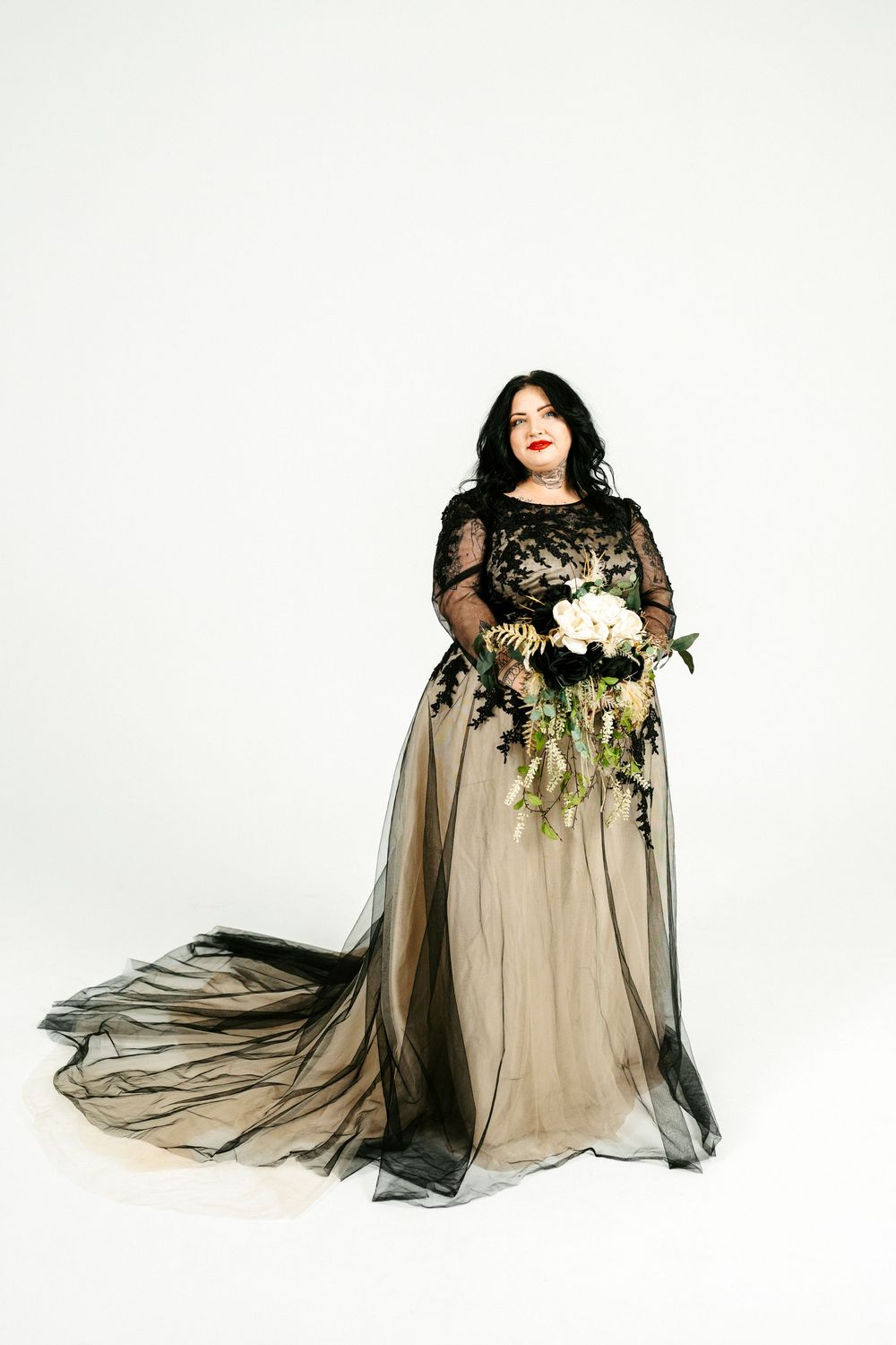 A figure in a black and beige flowing dress with a white bouquet poses gracefully in a four-part photo series against white.