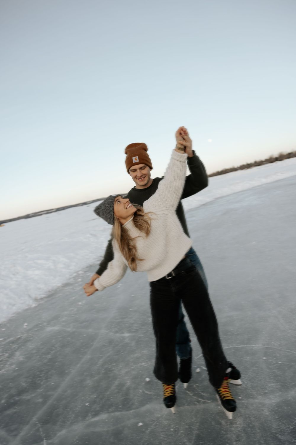 A sequence of images showing someone ice skating and performing graceful movements on a frozen lake surface.