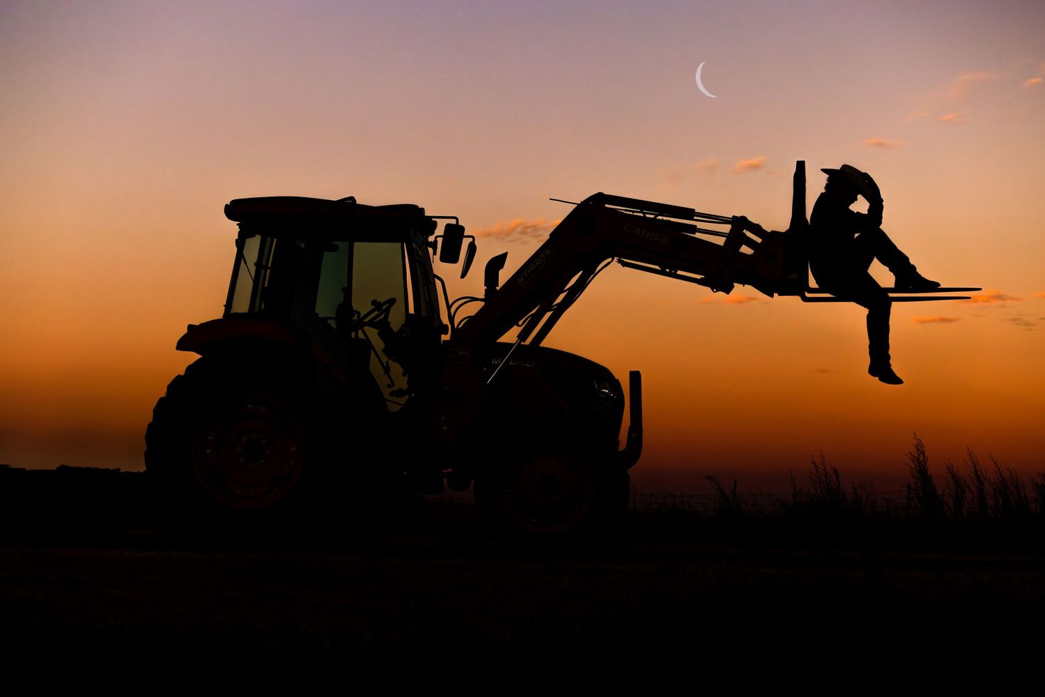 cowboy silhouette with tractor and moon, vacaville california, country boy, senior portrait, sunset
