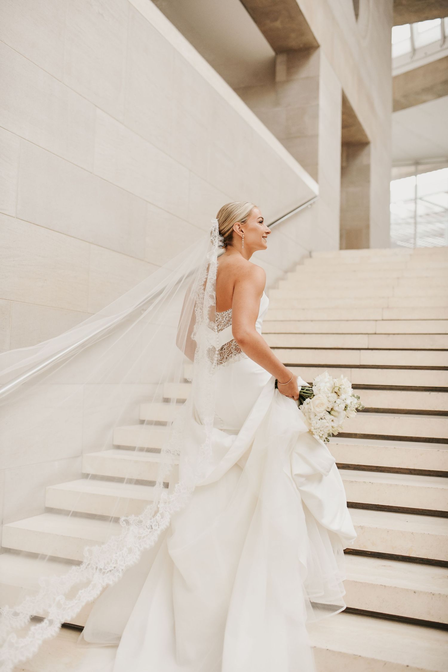 Bride showcasing her fitted wedding gown during a sophisticated Dallas bridal session