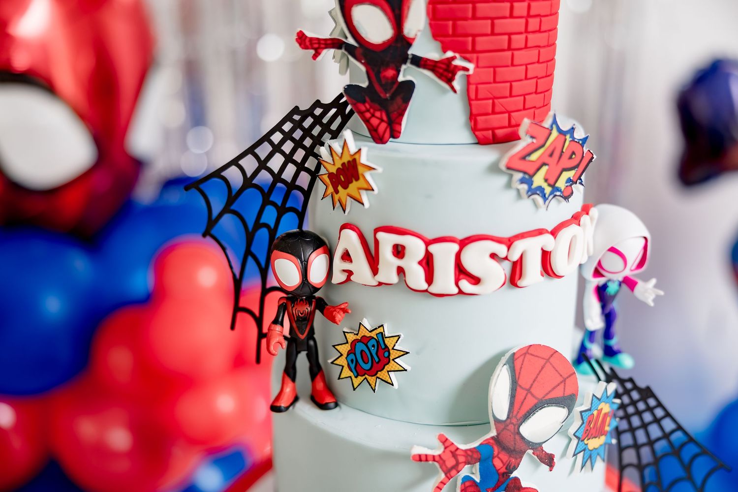Detail shot of Ariston's Spiderman birthday cake with Miles Morales and comic book decorations.