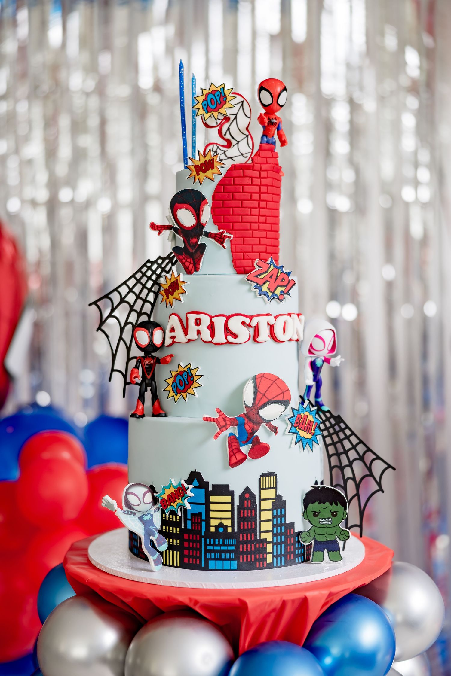 Three-tier Spiderman themed birthday cake decorated with Marvel characters for Ariston's birthday.