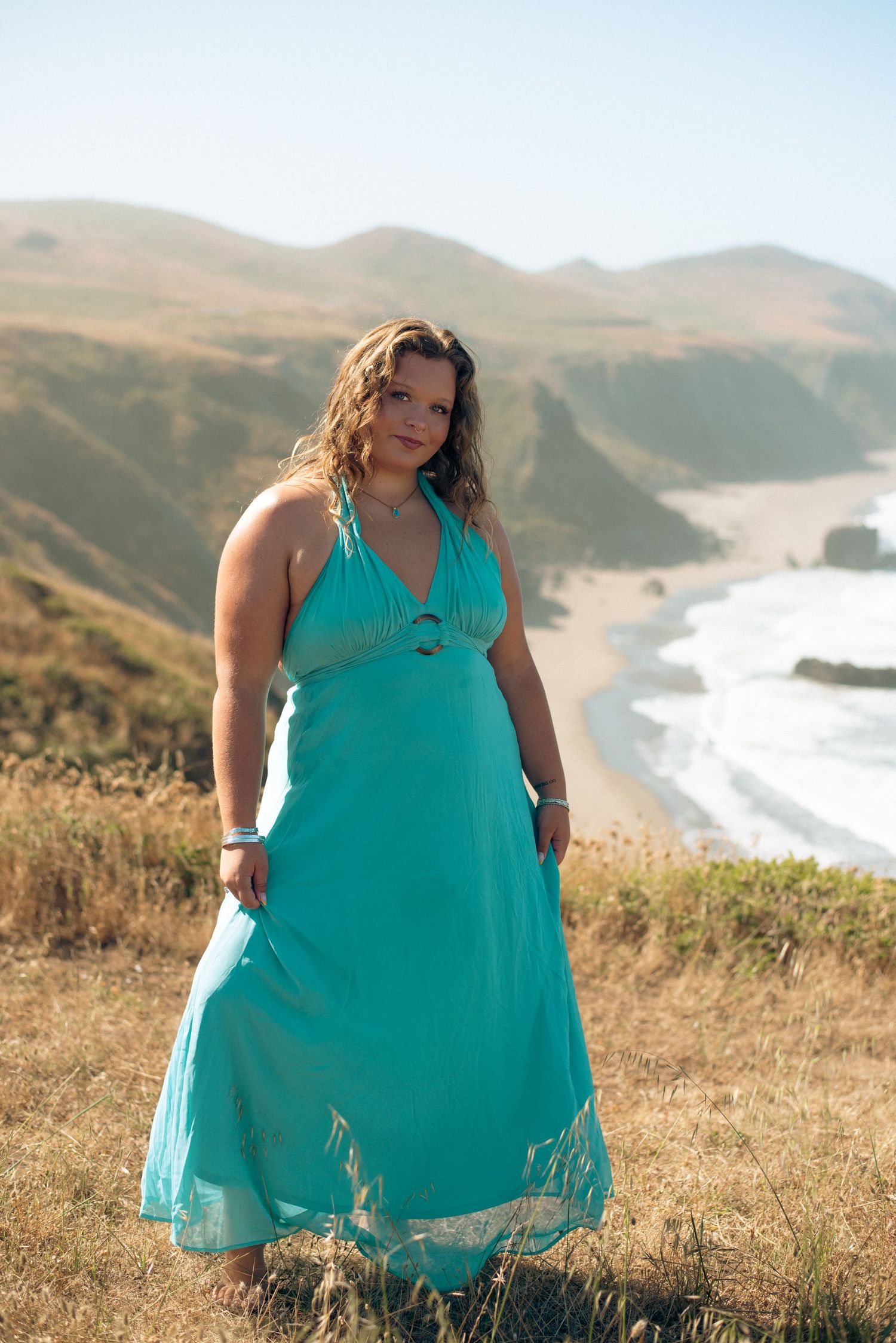 Outdoor senior portraits in Sonoma County capturing genuine smiles, natural movement, and the beauty of this season of life.