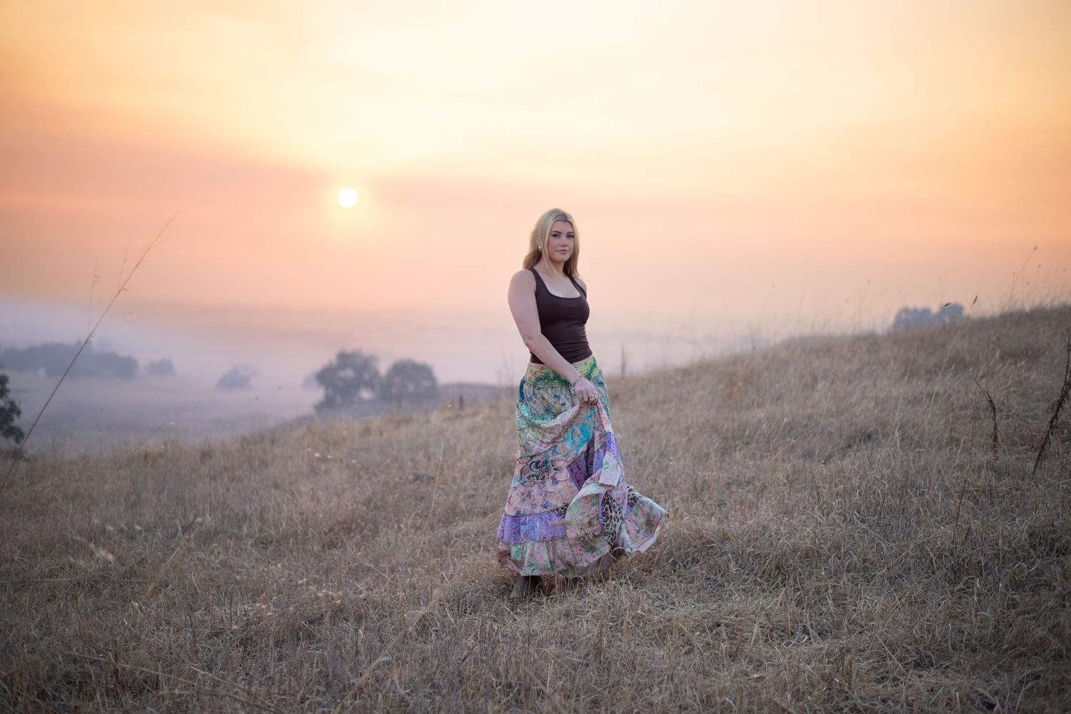 A cinematic senior session unfolding in golden hour light—wind in their hair, open Sonoma landscapes, and a little nostalgia.