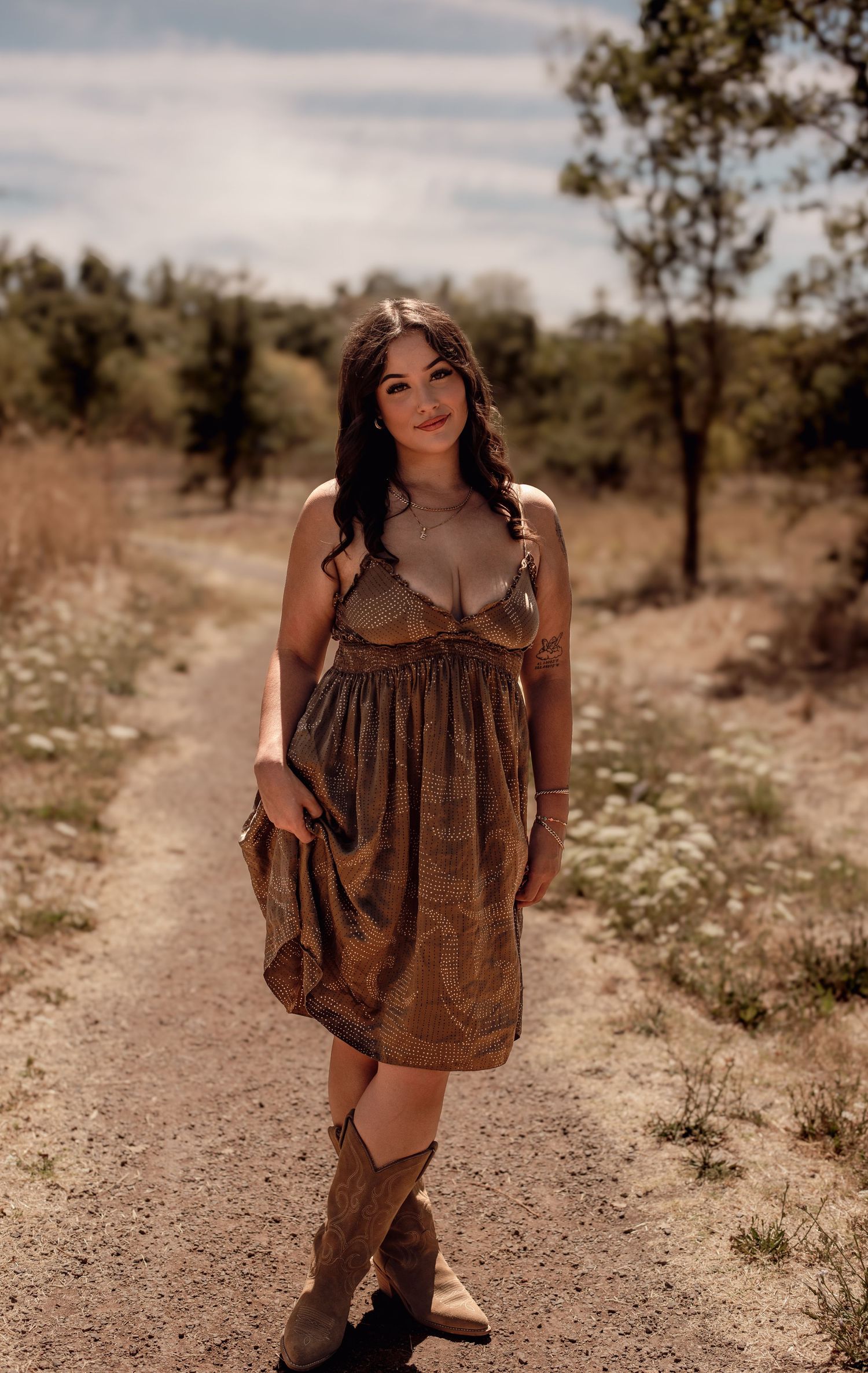 A cinematic senior portrait session unfolding through golden Sonoma County fields, with wild grass, soft light, and a feeling of freedom.