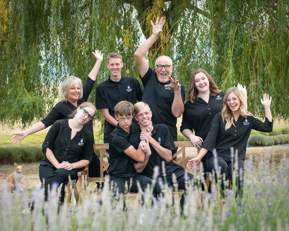 team of employees outside environmental group portrait of Spokane company by professional photographer Luba Wold in Post Falls