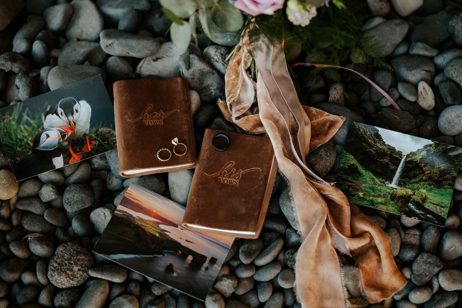 detail photos of vow books, bouquet, wedding rings, and postcards from Iceland on the iconic black sand beach at Reynisfjara Beach, Iceland