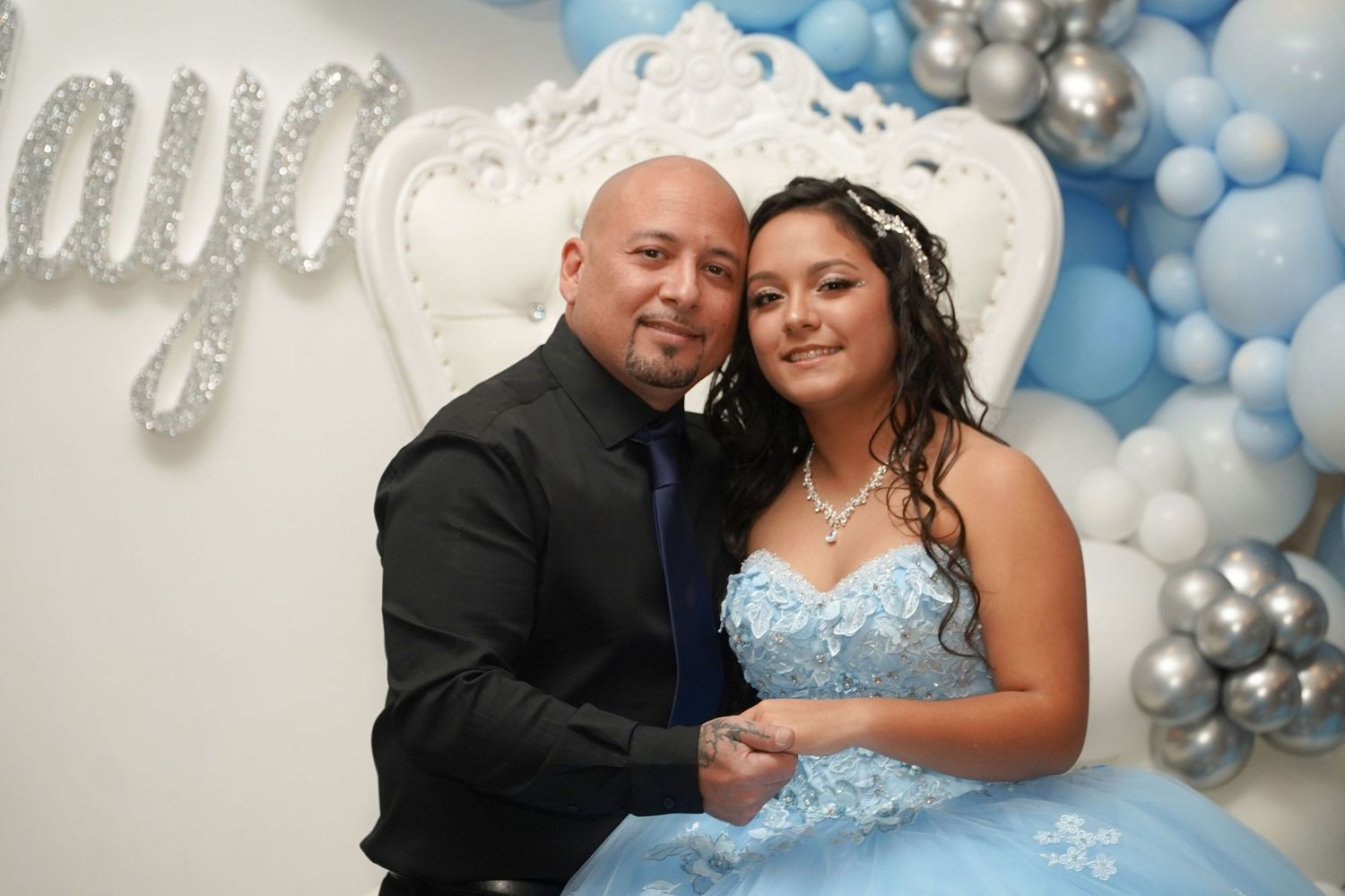 Busy Quince ballroom during open invite celebration showing guest management, quince planner, venue safety and seating organization
