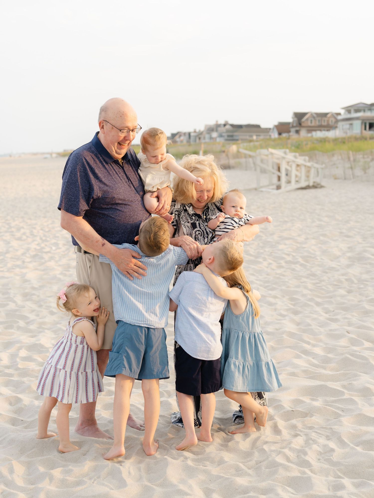 Grandparents sharing a candid, fun moment with their grandchildren in Mantoloking Beach NJ.