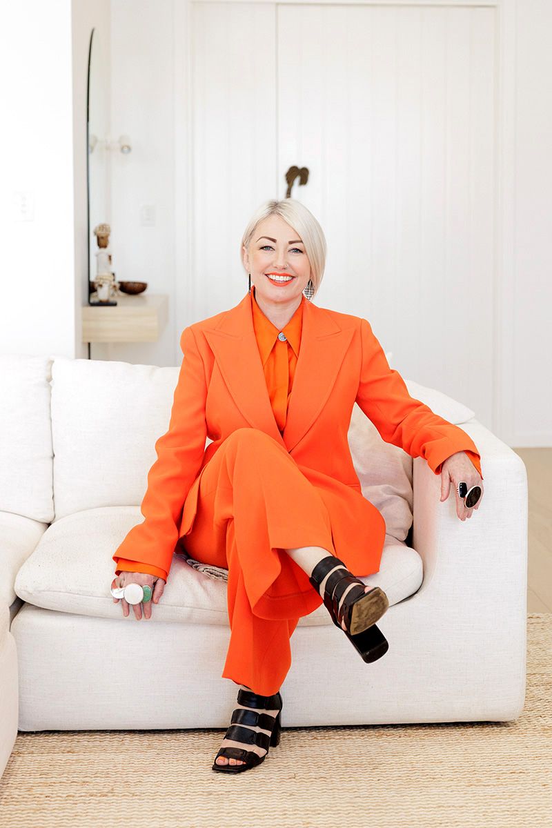 Personal branding photography Adelaide — woman in orange outfit bold business portrait