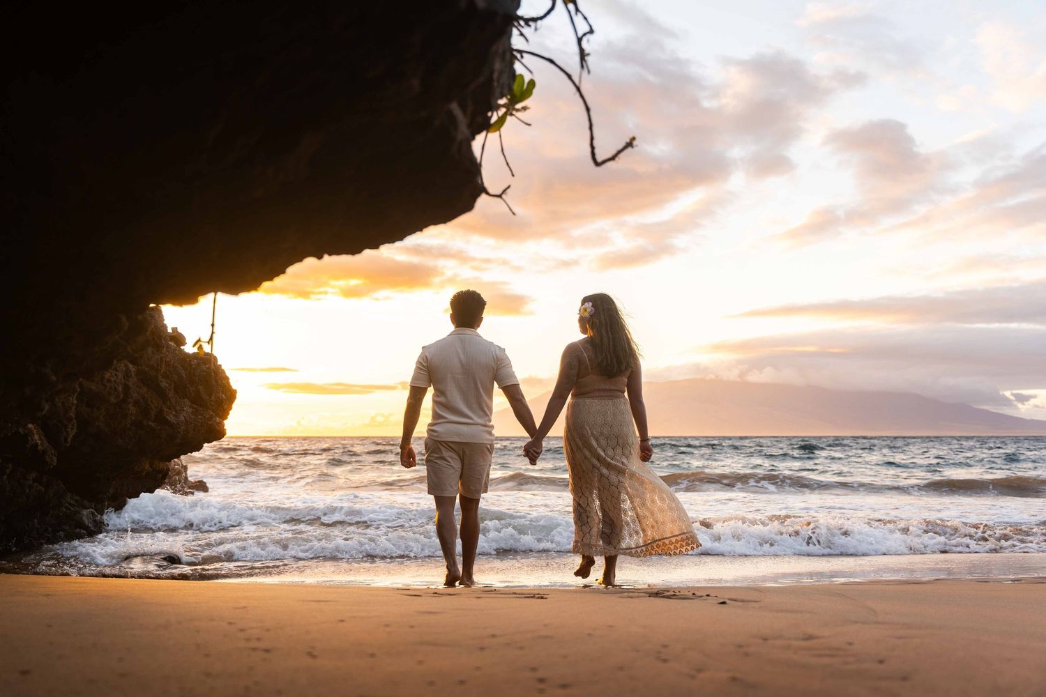 Maui wedding photographer photo against beautiful Maui sunset beach by ohwowfotos.