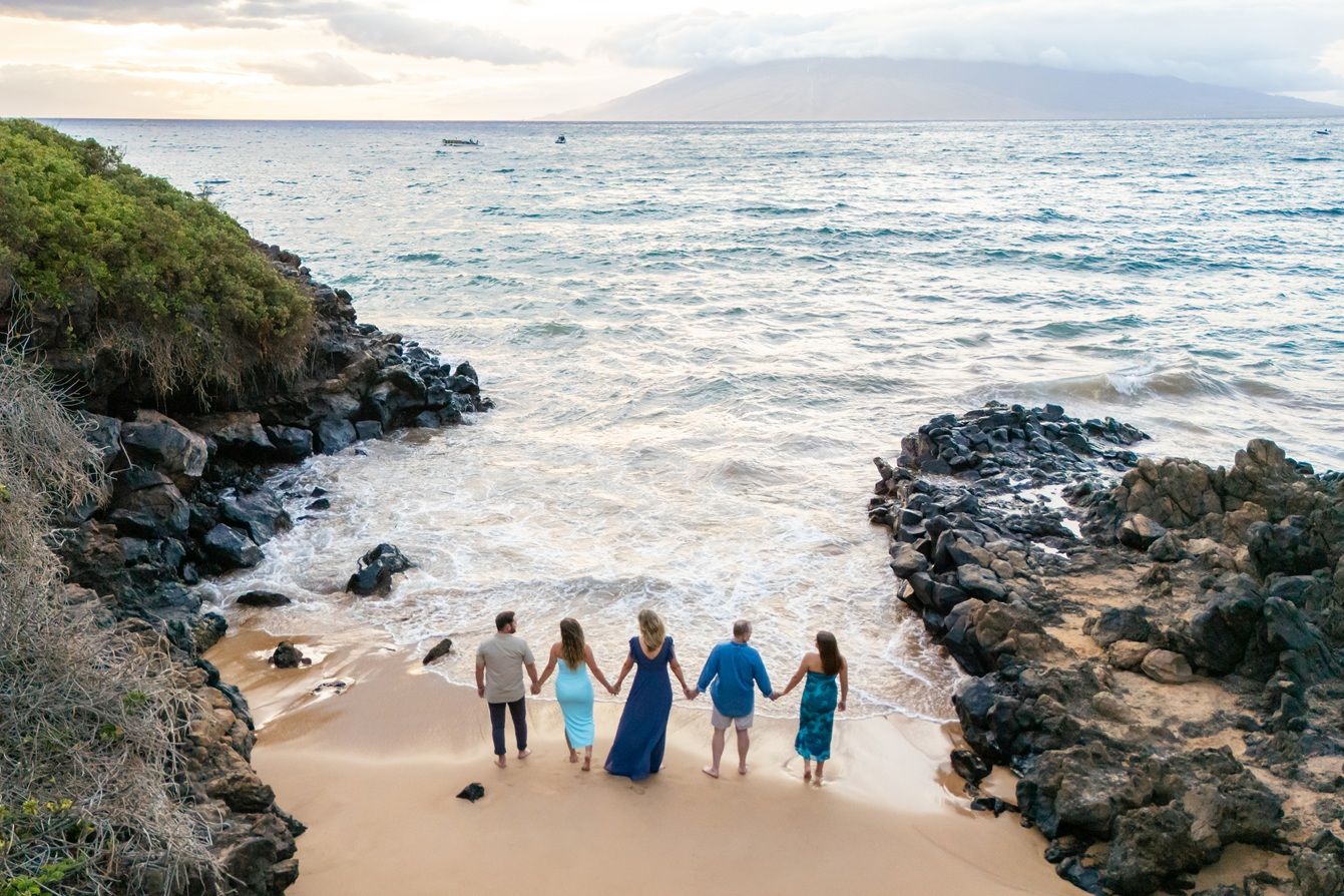 Maui family photographer photo against beautiful Maui sunset beach by ohwowfotos.