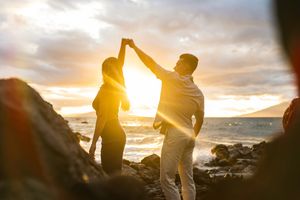 Maui couple engagement photographer photo against beautiful Maui sunset beach by ohwowfotos.