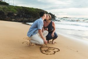 Maui couple engagement photographer photo against beautiful Maui sunset beach by ohwowfotos.