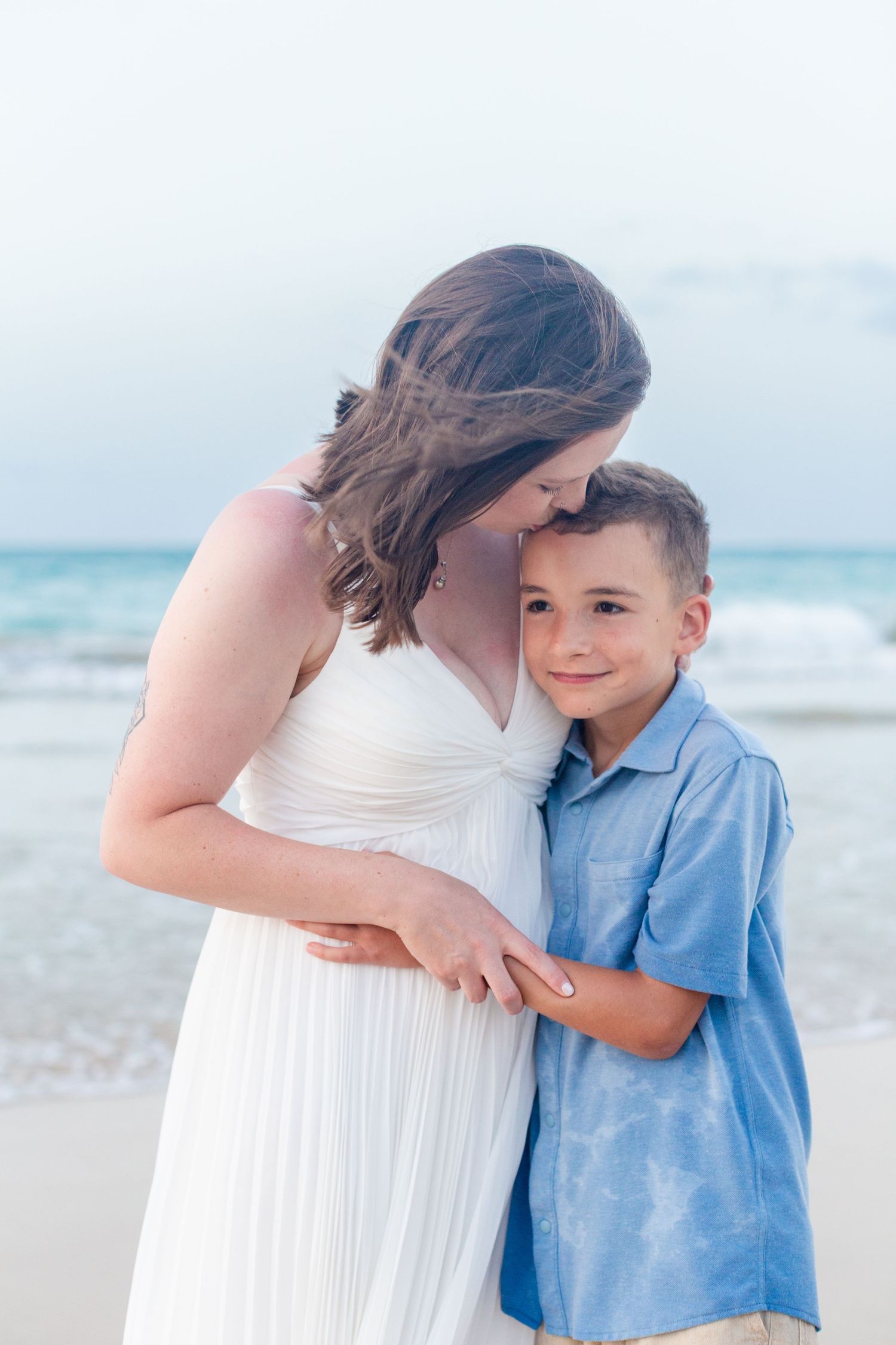 Portrait of mother and son on the beach in Isla Verde, Carolina, Puerto Rico.