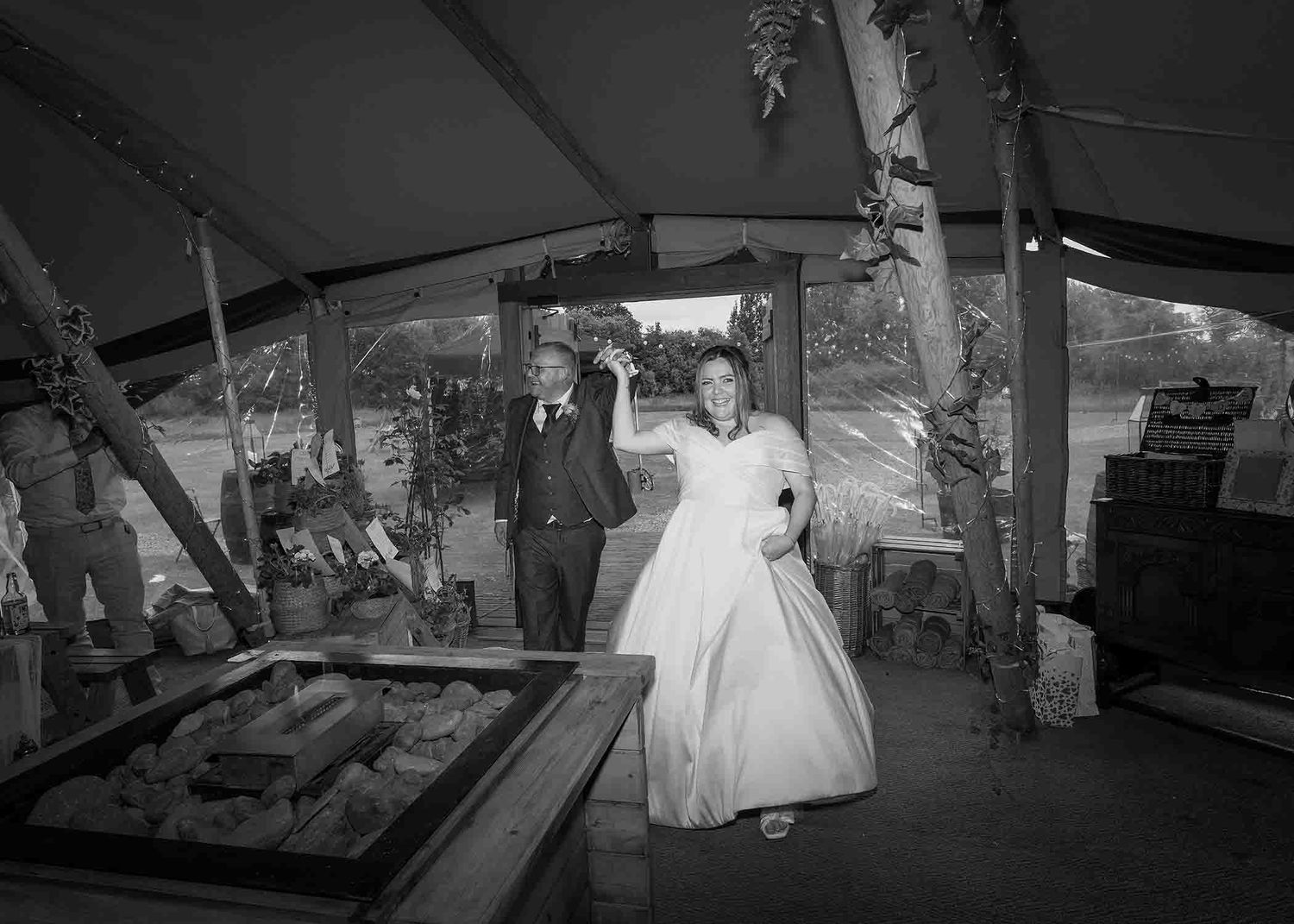 Bride and groom enter the tipi to be greeted by guests before the speeches and wedding breakfast.
