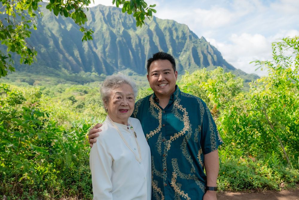 mom and son wedding portrait with koolau mountains behind them.