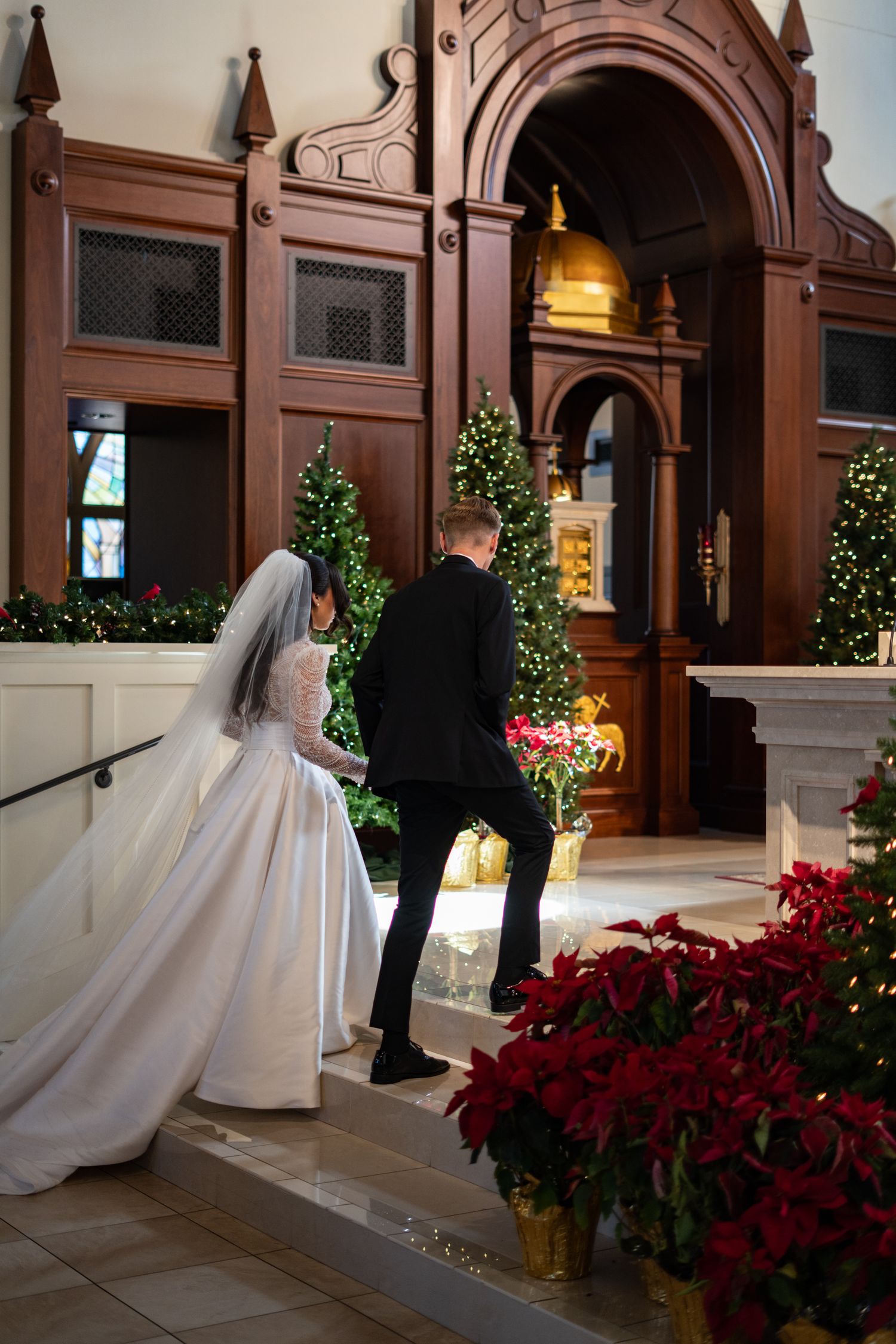 Bride and groom at altar Catholic wedding ceremony Corpus Christi Church Kissimmee Florida Weddings by Ray