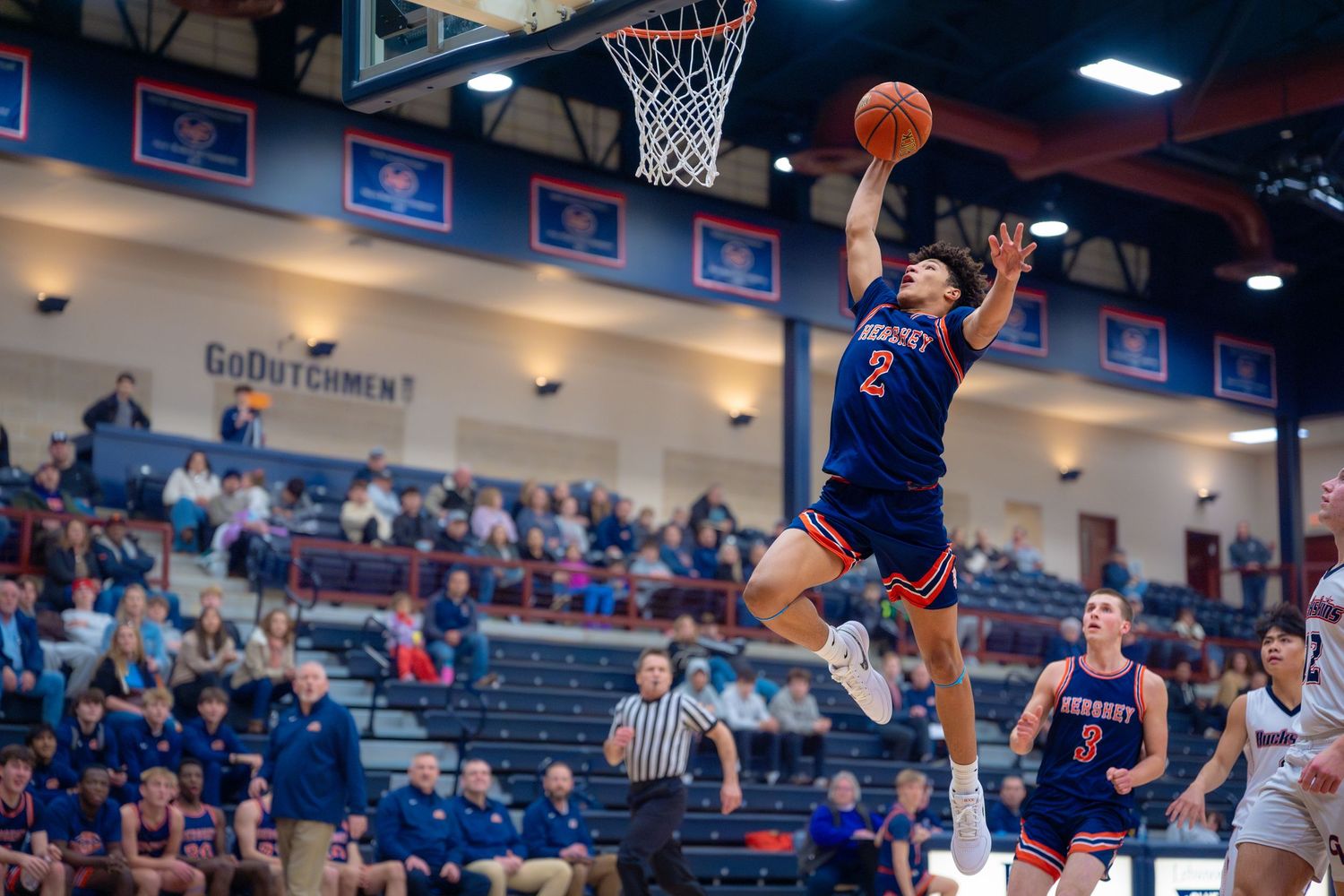 Hershey boys basketball player driving for a layup at Lebanon Valley College, by Deanna Fox, SportsFox Photography based in Hershey PA