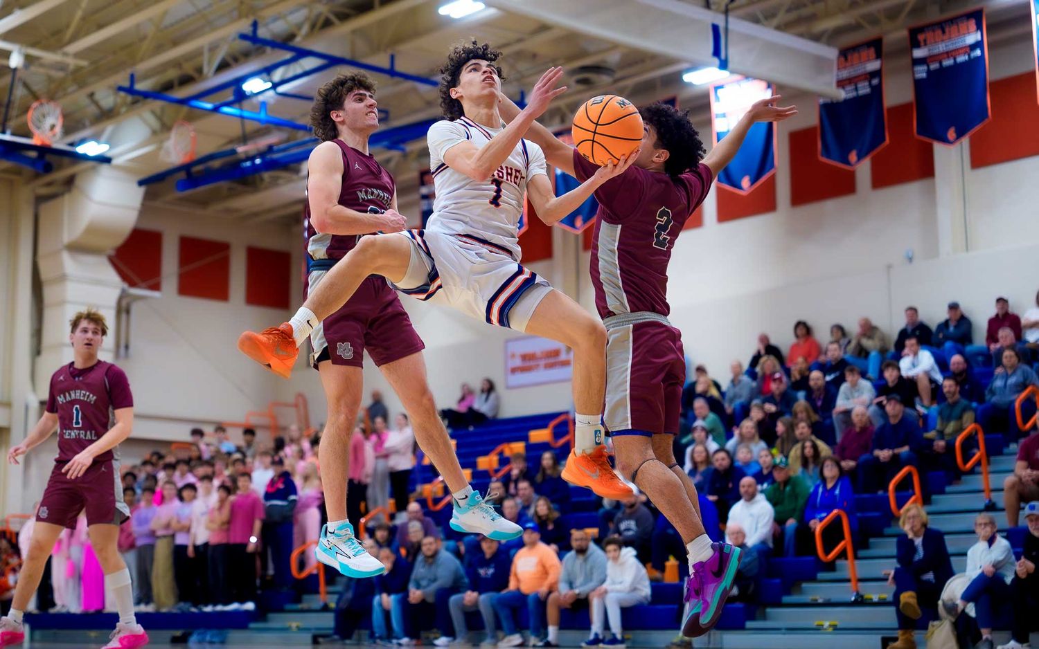 Hershey #1 driving for a layup past Manheim Central, PIAA Districts round one, by Deanna Fox, SportsFox Photography based in Hershey PA