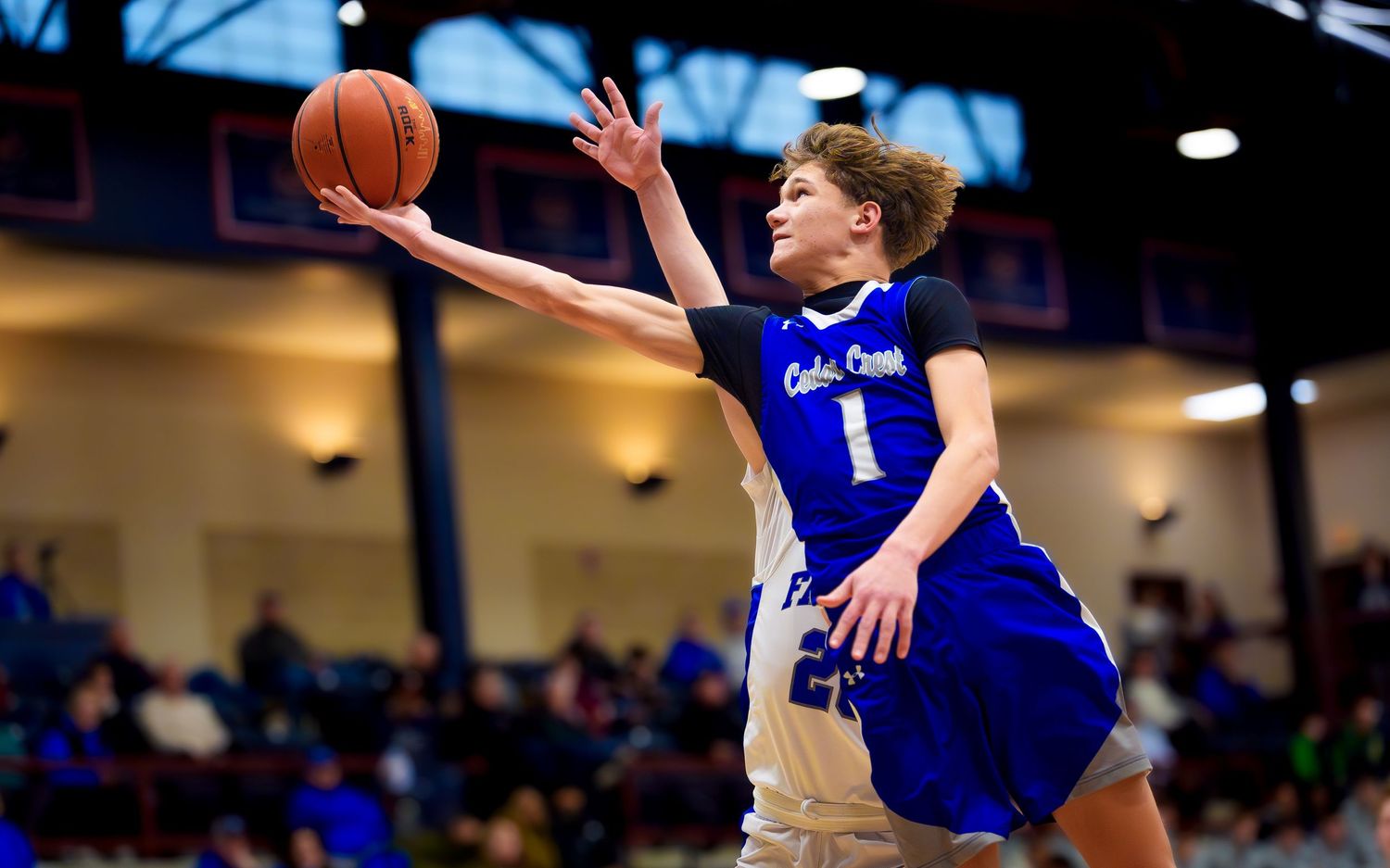 Cedar Crest player driving for a layup vs Lower Dauphin, Rhodes Classic, by Deanna Fox, SportsFox Photography based in Hershey PA