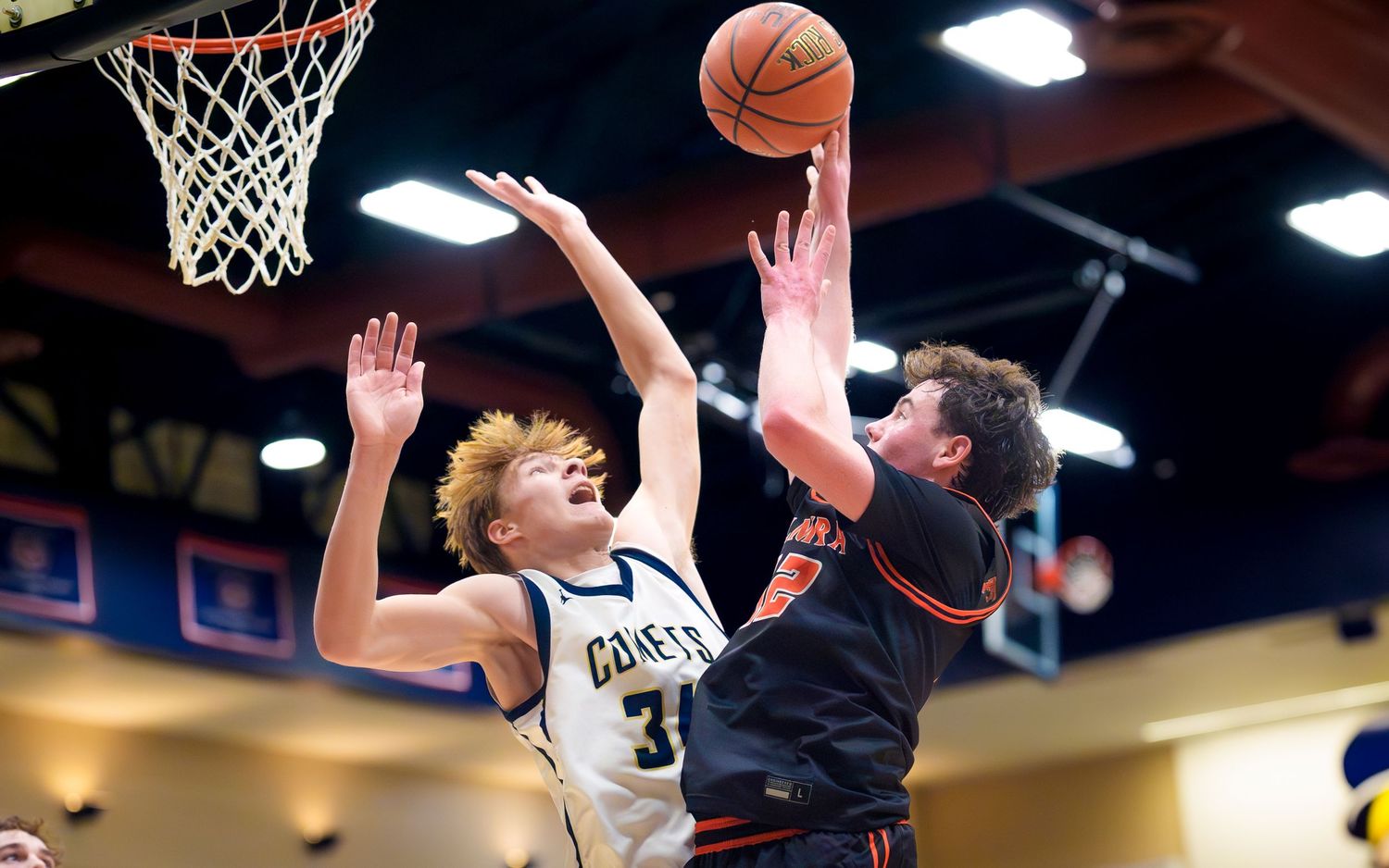Palmyra Cougars player shooting over a Penn Manor defender, Rhodes Classic, by Deanna Fox, SportsFox Photography based in Hershey PA