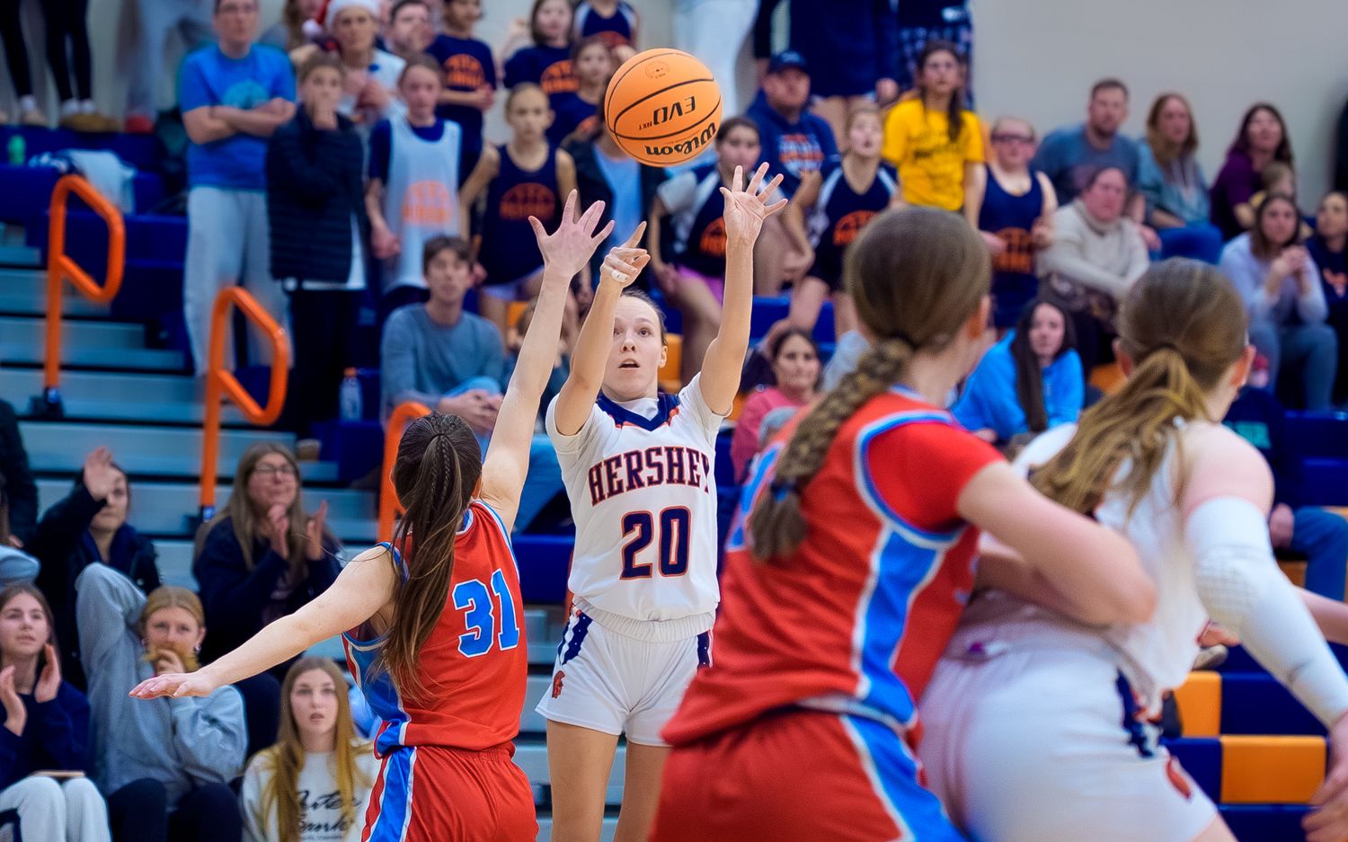Hershey's Taylor shooting a buzzer-beating three over Redland defenders, by Deanna Fox, SportsFox Photography based in Hershey PA
