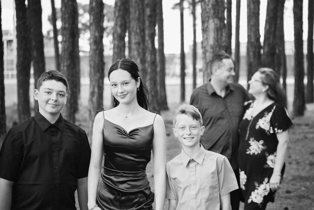 beautifully posed family of five for their family mini session in Miami Gold Coast