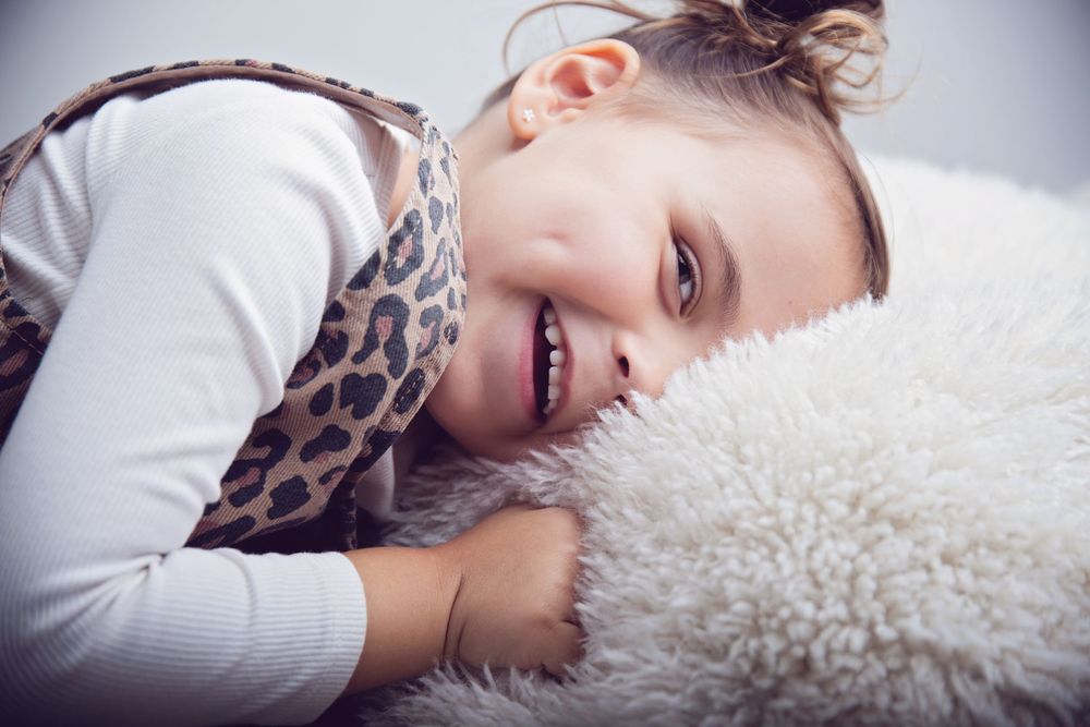 quick cute photo of a 4yr old girl st her session being shy