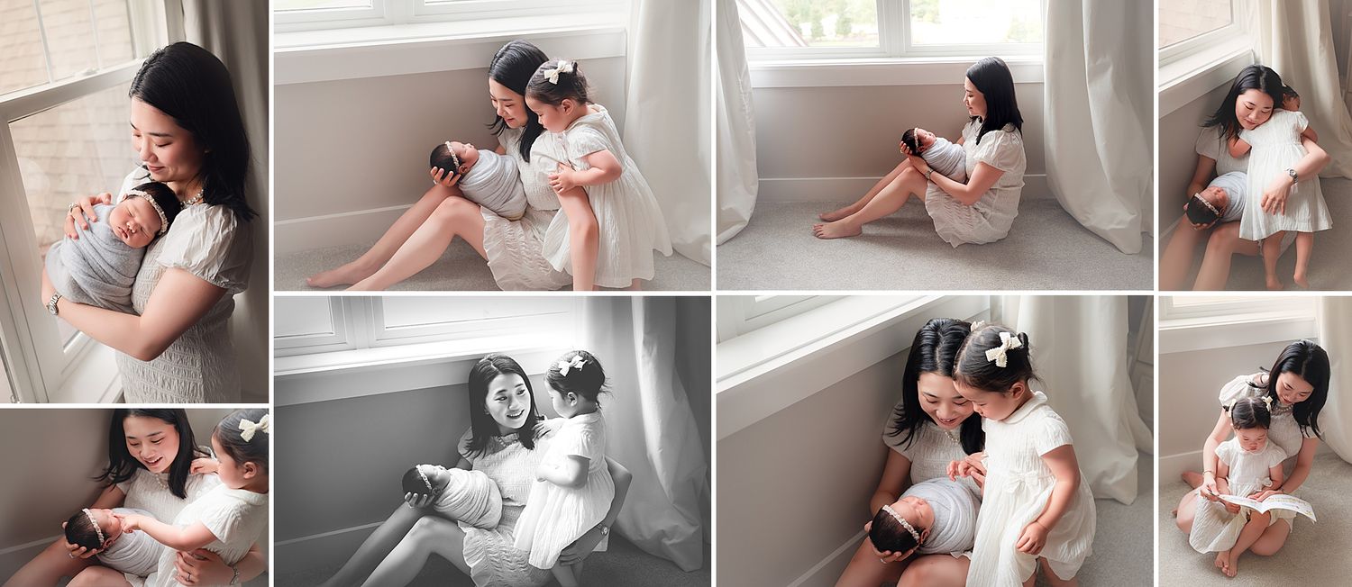 A mother tenderly holds her newborn while siblings share sweet moments together in soft natural window light.
