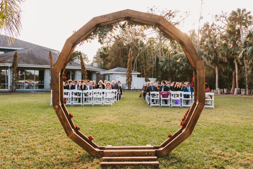 Channel Side Club in Palm Coast Florida. Wedding photography of outdoor ceremony. Wooden arch