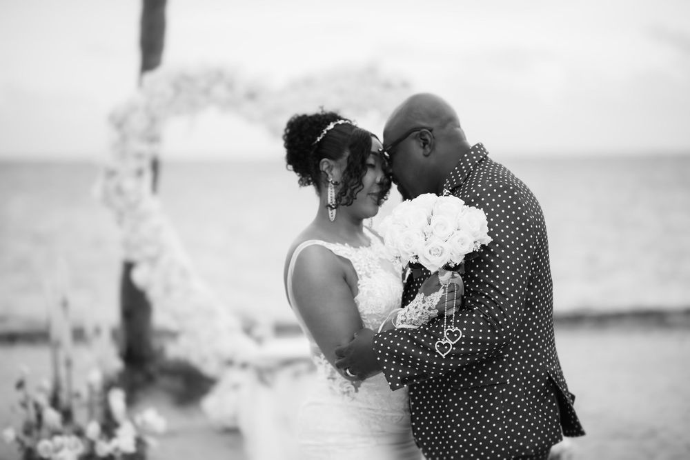 Newlywed couple embracing in elopement wedding at Crandon Park Miami.