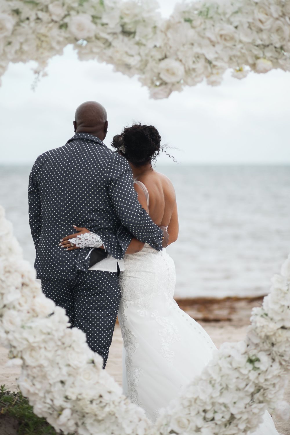Newlywed couple embracing in elopement wedding at Crandon Park Miami.