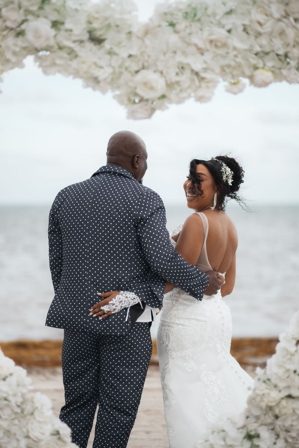 Newlywed couple embracing in elopement wedding at Crandon Park Miami.