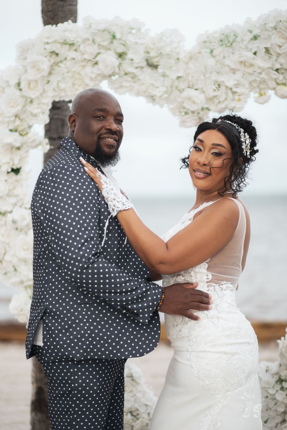 Newlywed couple embracing in elopement wedding at Crandon Park Miami.