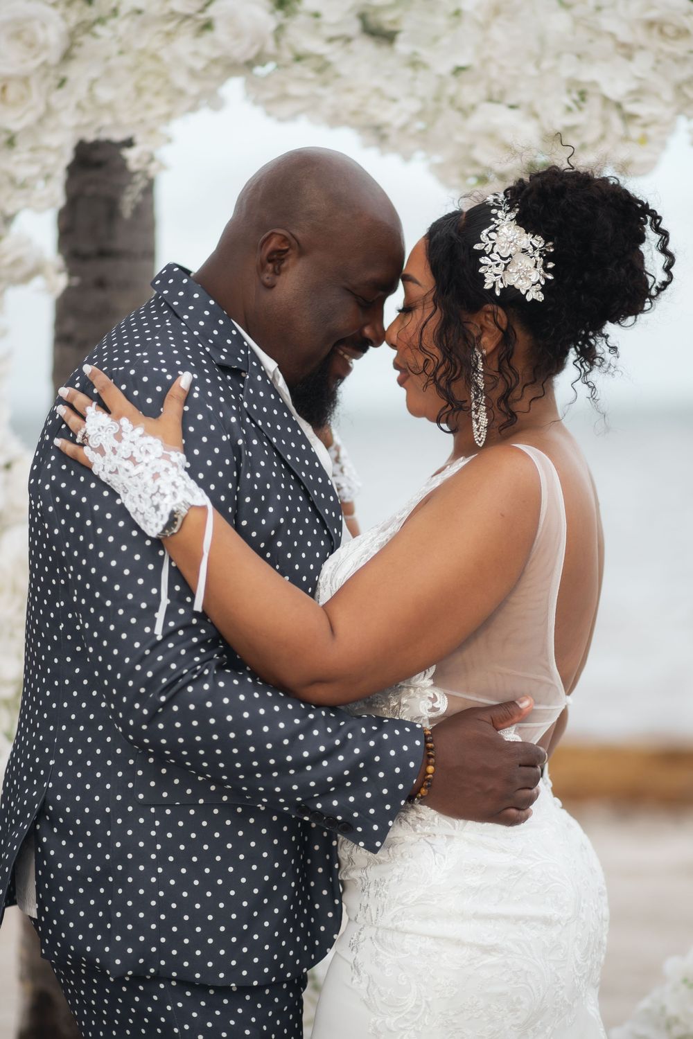 Newlywed couple embracing in elopement wedding at Crandon Park Miami.