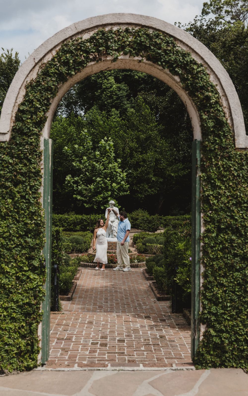 Couple during their romantic engagement session at Bayou Bend Collection and Gardens in Houston, Texas.